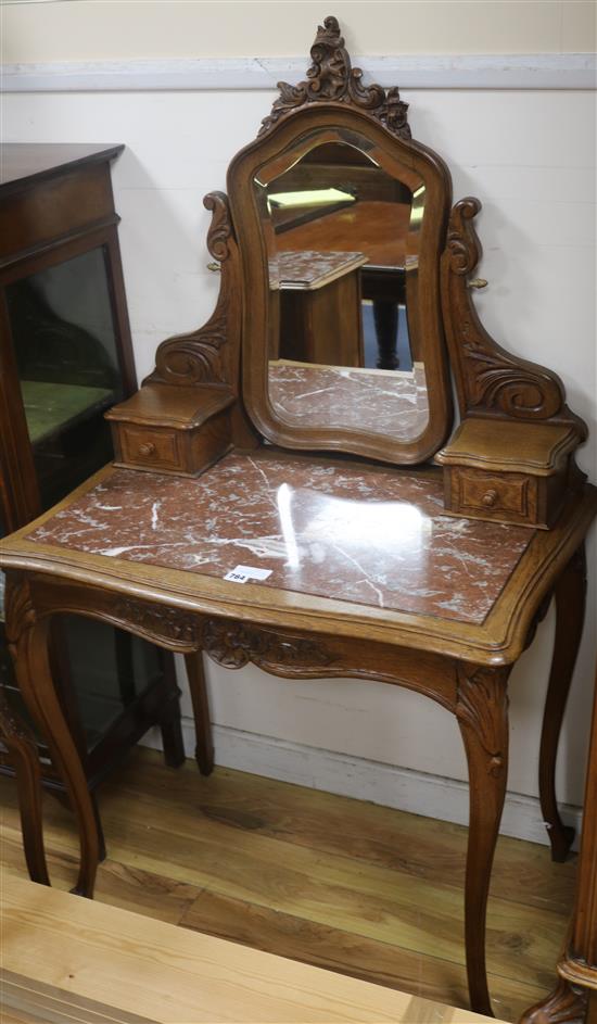 A French carved oak and rouge marble topped dressing table and matching bedside cupboards Dressing table 79cm